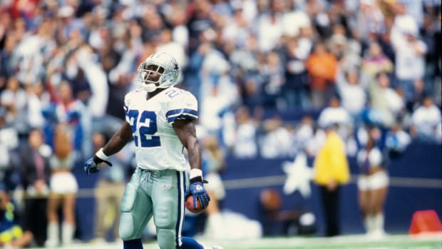Dallas Cowboys running back Emmitt Smith celebrates a touchdown.